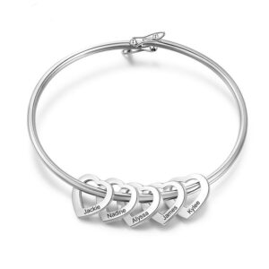 An image of a silver bangle with five custom heart charms